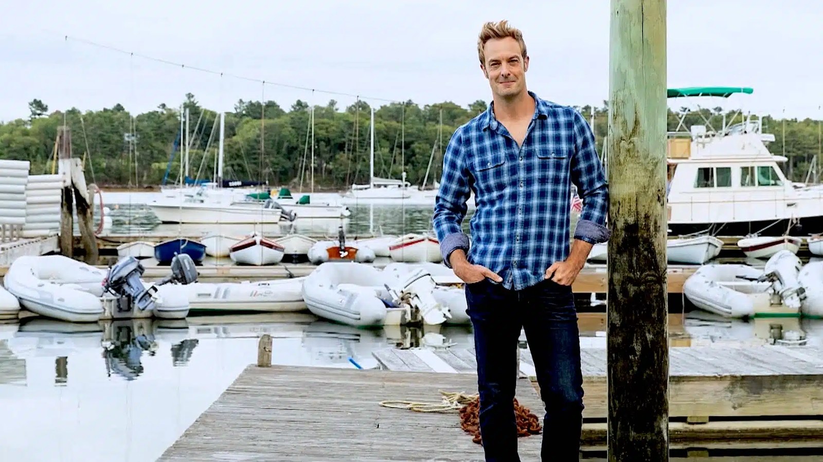 Barton Seaver standing beside a marina.